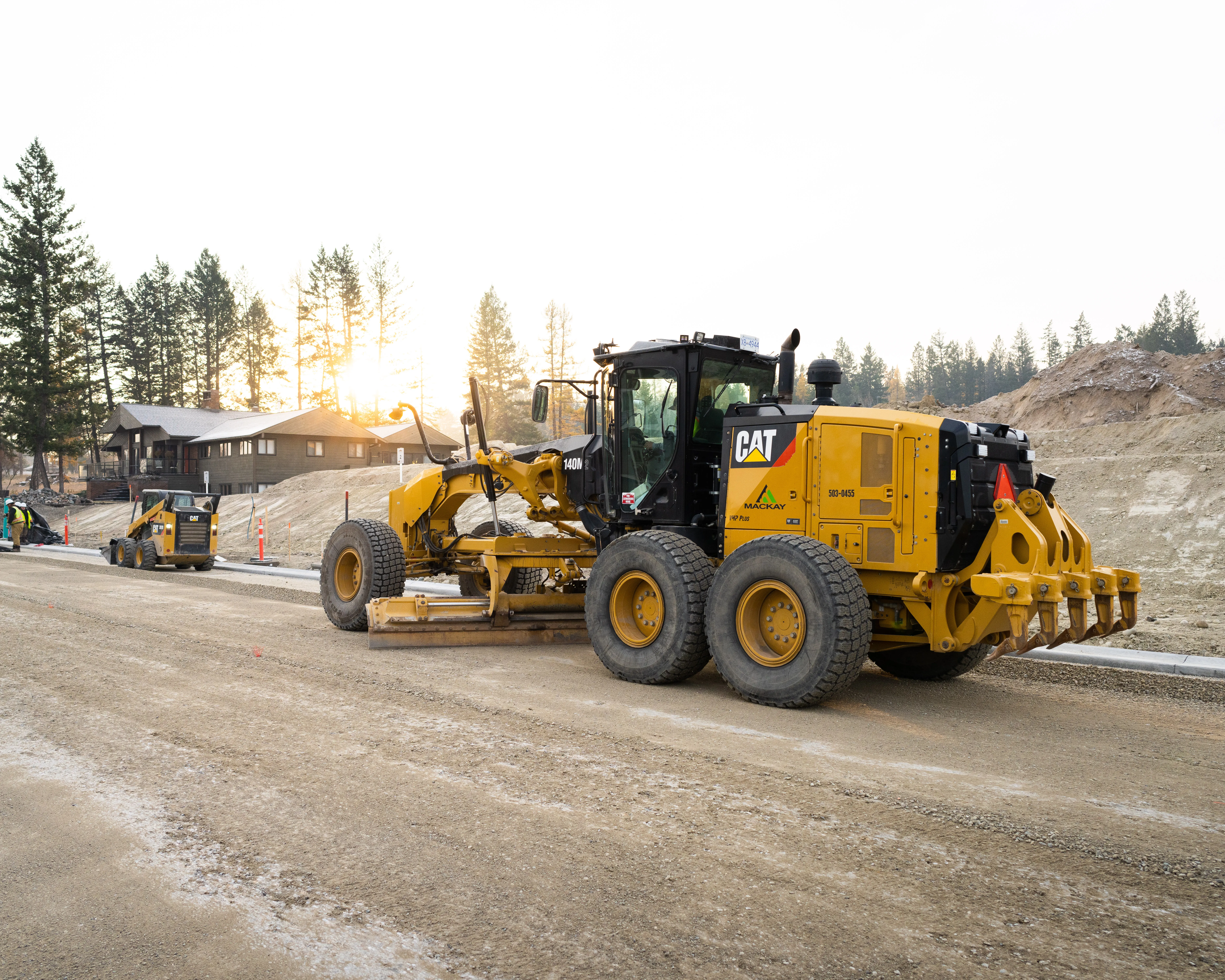 Mackay grader working the rebuilt 4th Street corridor at sunrise