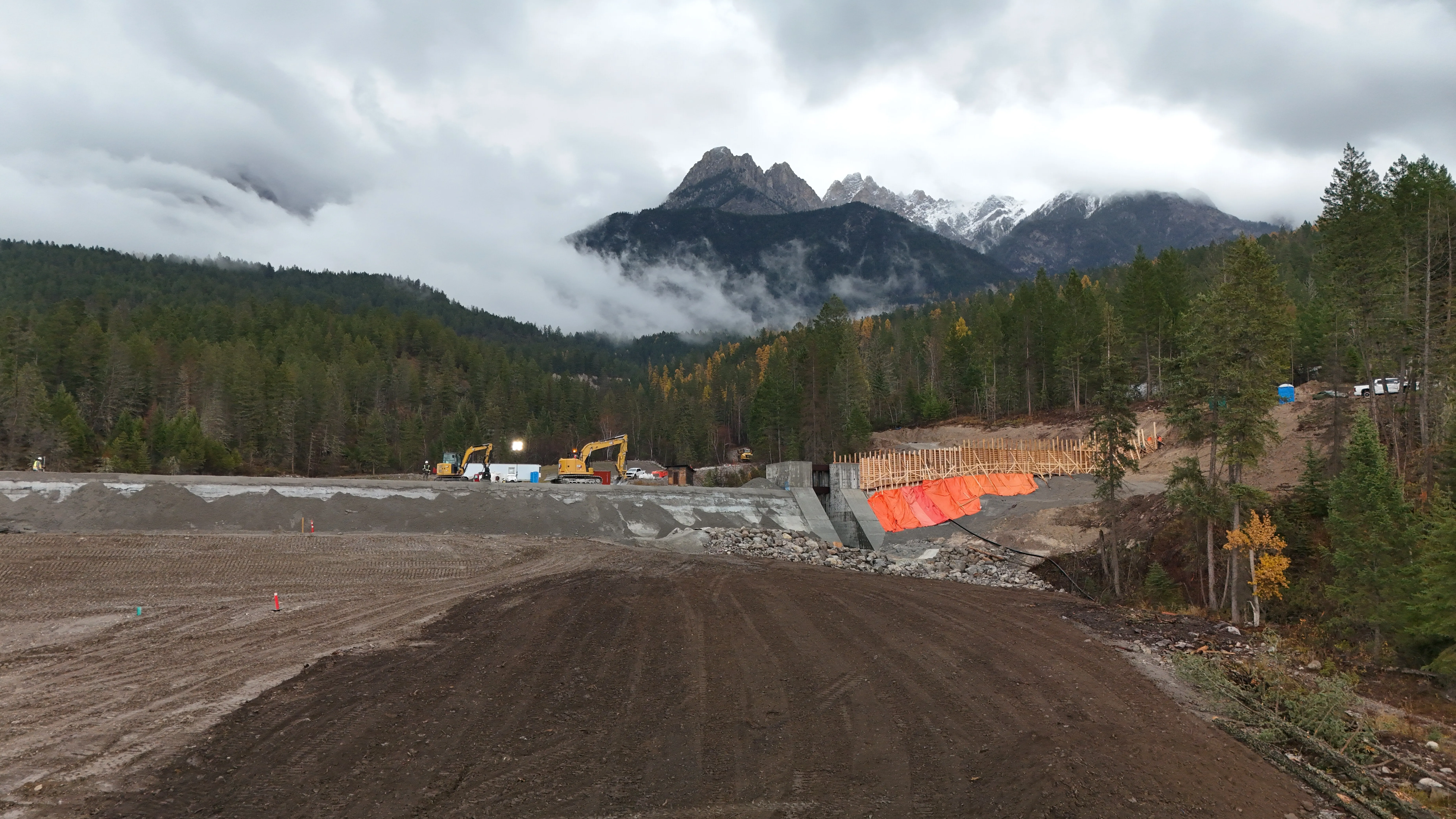 Misty mountain valley over an active Mackay work site
