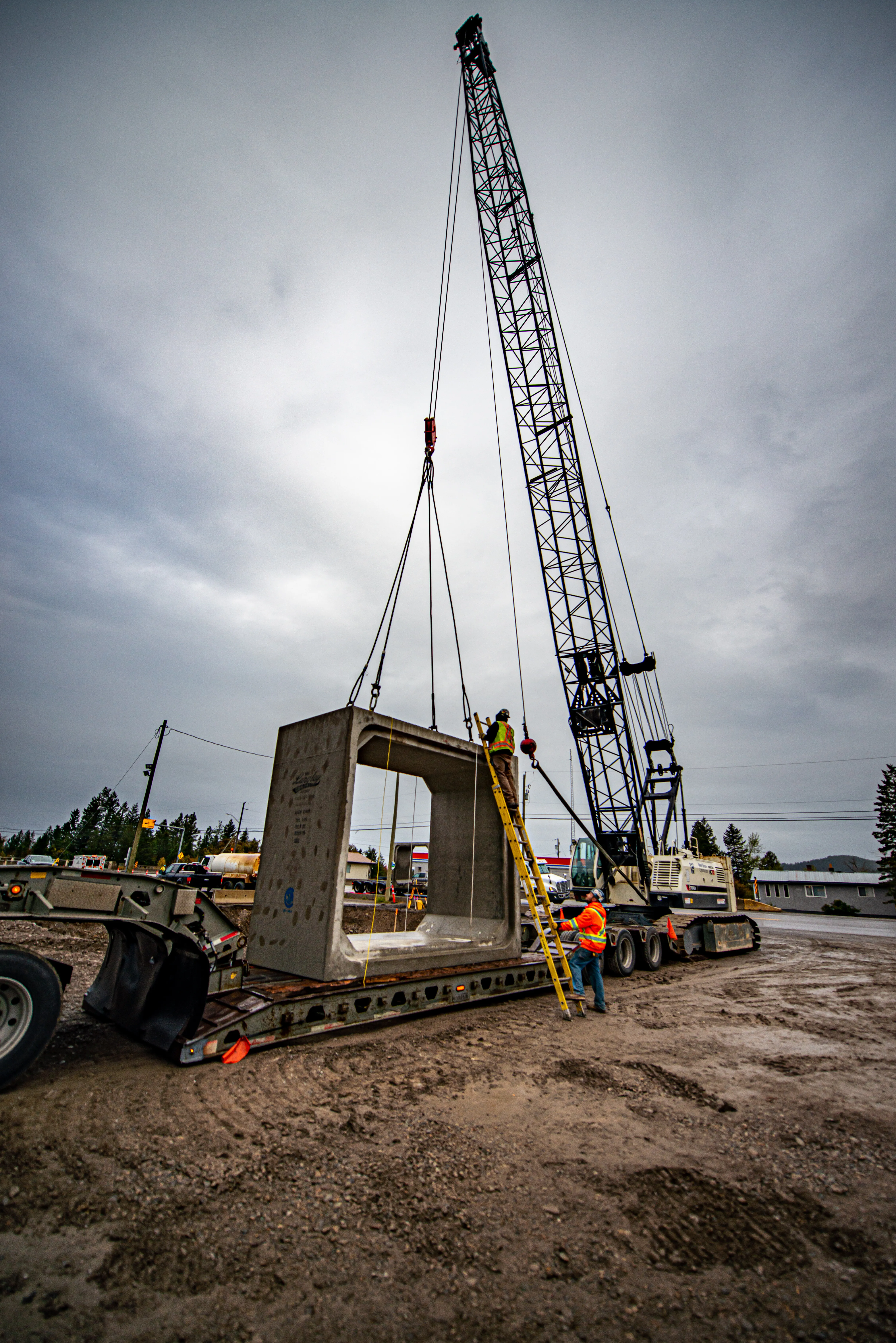 Crane lifting a precast concrete box culvert at the Elko Overhead site